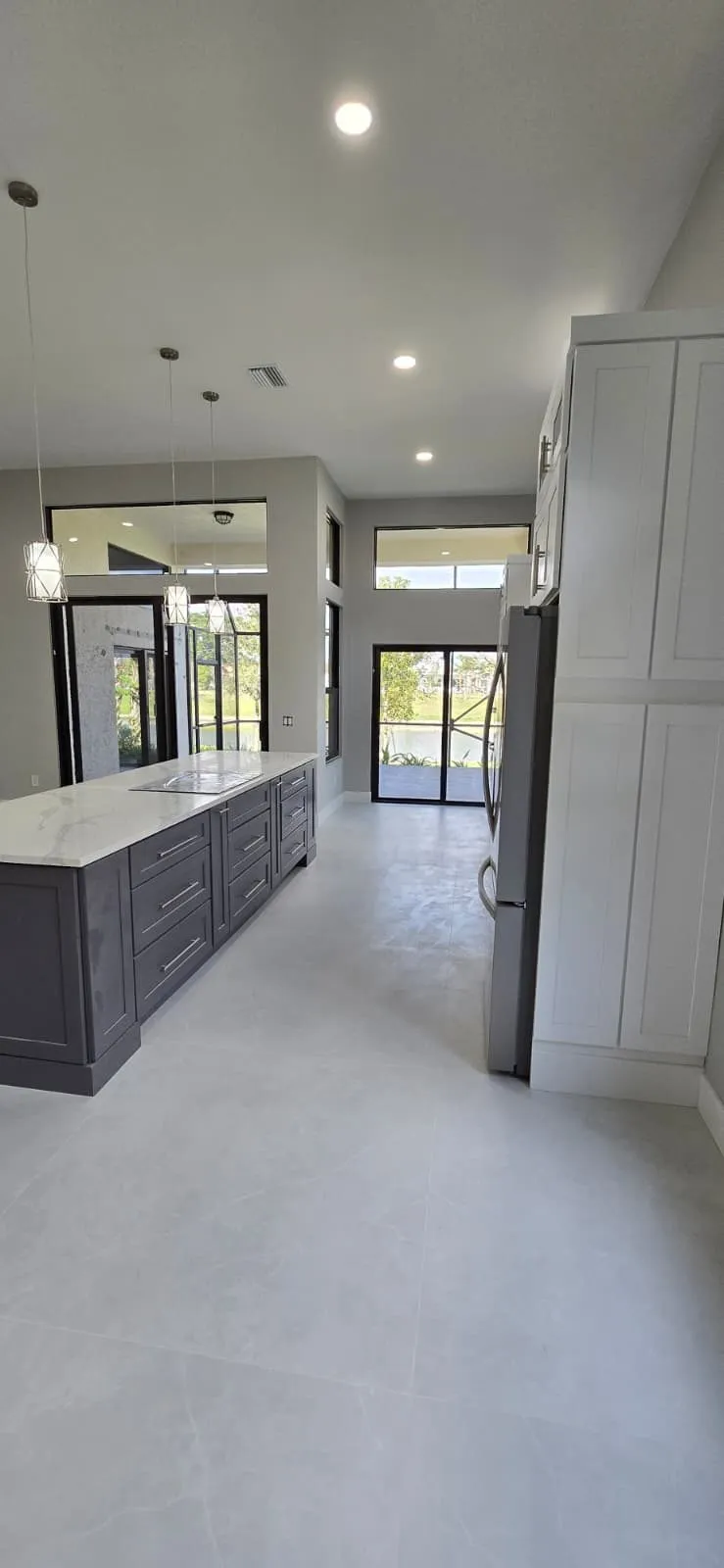 Charcoal shaker island with white quartz countertop